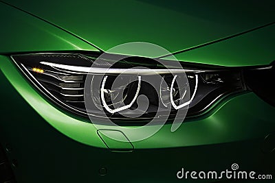 Headlights angel eyes green BMW M4 tuning in the dark Editorial Stock Photo