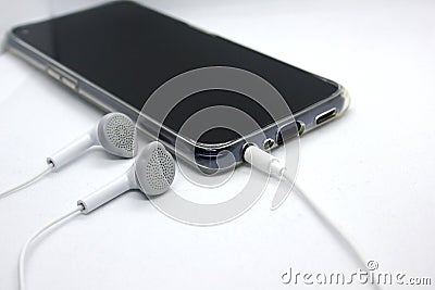 Headphone cable ready to work with mobile Stock Photo