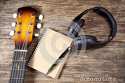 Headphone guitar notebook pencil Stock Photo