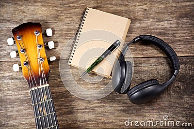 Headphone guitar notebook pencil Stock Photo