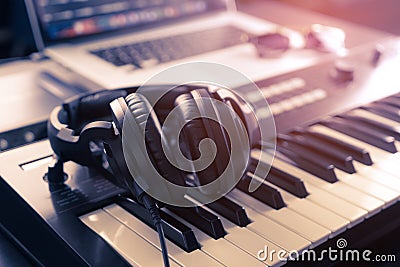 Headphone on home Music studio keyboard Stock Photo