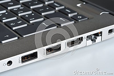 Headphone jack, Usb ports, HDMI and rj45 lan port on the side of a modern laptop. Closeup Stock Photo