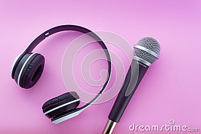 Headphone and microphone on pink background Stock Photo