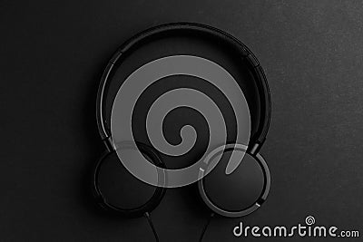 Headphone. Music concept. Flat lay: headphones on black background. Top view. Trendy colorful photo Stock Photo