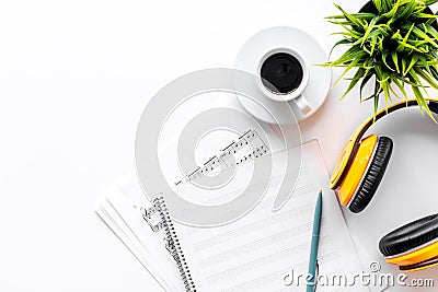 Headphone with white paper note in music studio for dj or musician work on white background top view mock-up Stock Photo