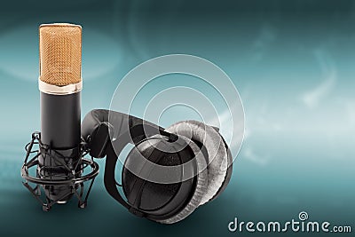 Headphones and condenser microphone on the green background Stock Photo