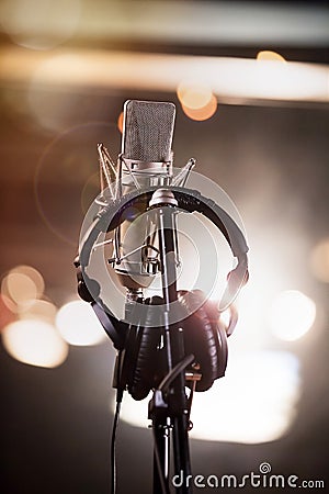 Headphones and Condenser Microphone in a Music Recording Studio Stock Photo