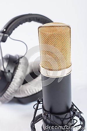Headphones and condenser microphone on the white background Stock Photo