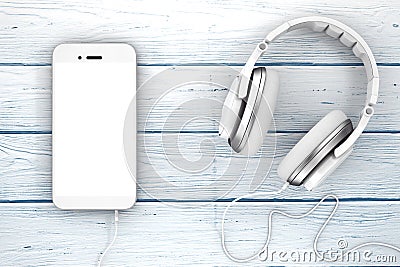 Headphones near Mobile Phone with Blank Touchscreen for Yours De Stock Photo