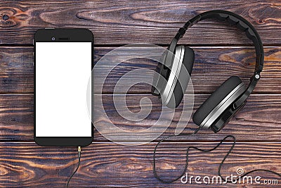 Headphones near Mobile Phone with Blank Touchscreen for Yours De Stock Photo