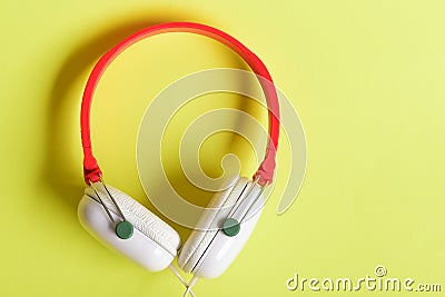 Headphones in white and red color with long wire Stock Photo