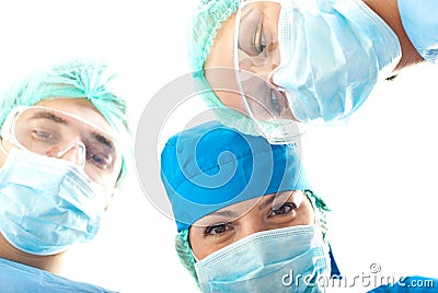 Heads of surgeons in operation Stock Photo