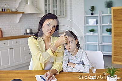 Headshoat portrait of mother and sick daughter speak video chat online using gadget at home. Stock Photo