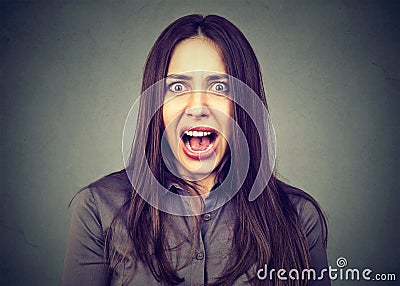 Headshot of an annoyed angry woman screaming Stock Photo