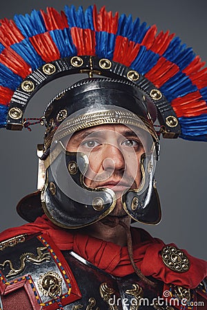 Headshot of isolated on gray roman warrior with plumed helmet Stock Photo