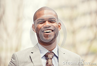 Headshot portrait of young professional man smiling laughing Stock Photo