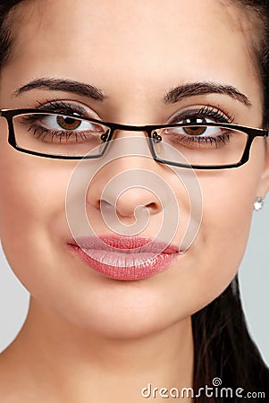 Headshot spanish woman wearing glasses Stock Photo