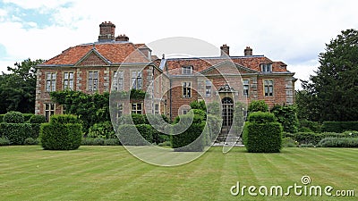 Heale House with lawn and topiary Stock Photo