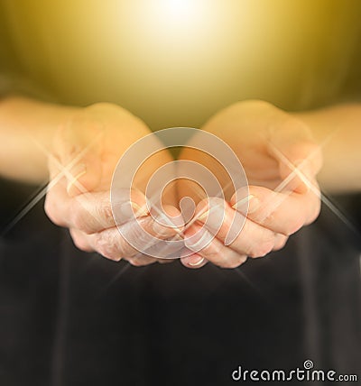 Healer with Golden Healing Orb Energy Stock Photo