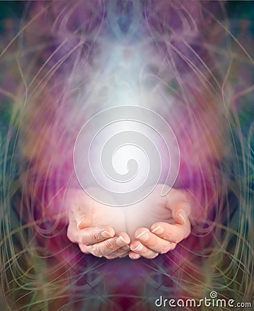 Healer's cupped hands and energy manifestation Stock Photo