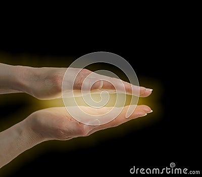 Healer sensing energy field Stock Photo