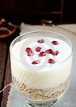 Healhty breakfast with oatmeal, greek yogurt and pomegranate Stock Photo