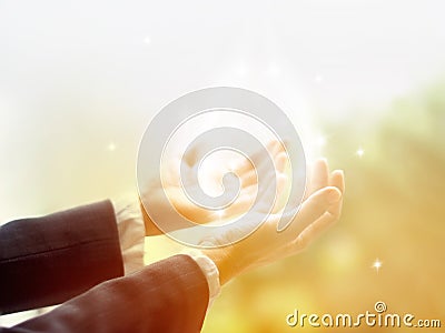Healing Circle of Light, Old female healer with hands open up surrounded by a white circle of color and white star light Stock Photo