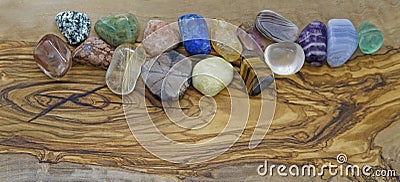 Healing crystals on olive wood background Stock Photo