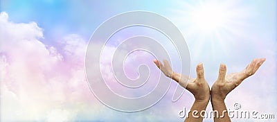 Healing Hands outstretched towards sun Stock Photo