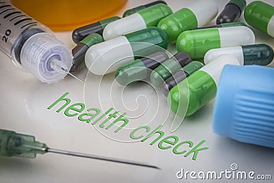 Healt check, medicines and syringes as concept Stock Photo