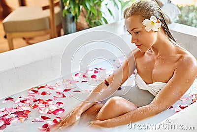 Health, Beauty. Woman Spa Body Care. Relaxing Flower Rose Bath Stock Photo