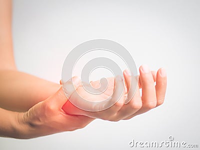 Close up woman holding her wrist symptomatic Office Syndrome. Stock Photo