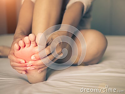 Health care concept. woman massaging her painful foot Stock Photo