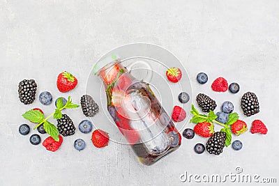 Healthy nutrition diet concept. Fresh cool berry and mint infused water, detox drink, in a glass jar Stock Photo