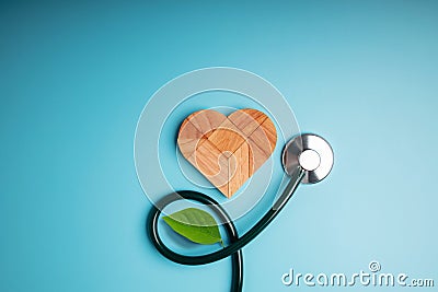 Health Care, Harmony and Organic Healthy Lifestyle Concept. Living and Close to Nature. Wooden Jigsaw as Heart Shape with Stock Photo