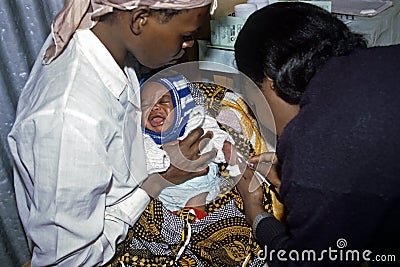 Health care for Kenyan baby with loving mother Editorial Stock Photo
