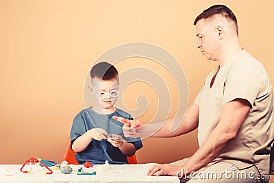 Health care. Medical examination. Boy cute child and his father doctor. Hospital worker. First aid. Medical help. Trauma Stock Photo