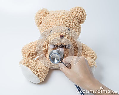 Health care teddy bear heart stethoscope on white background Stock Photo
