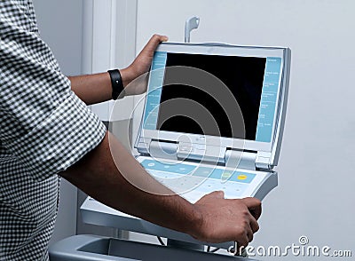 Health care worker operating a intra-aortic balloon pump machine Stock Photo