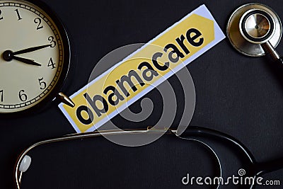 Health Check on the print paper with Healthcare Concept Inspiration. alarm clock, Black stethoscope.Obamacare on the print paper w Stock Photo