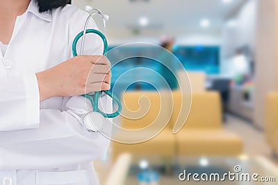 Close up portrait of female doctor standing posing in front of hospital office Stock Photo