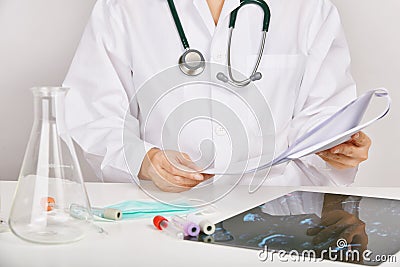 Health check up report chart, Doctor analyzing medical test Stock Photo
