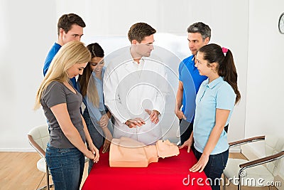 Health class instructor demonstrating cpr techniques Stock Photo