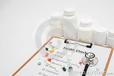 Health concept with clipboard and health check related items. Stock Photo