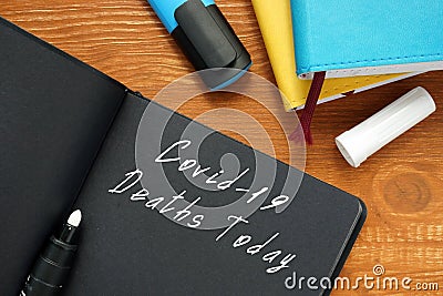 Health concept about covid deaths today with phrase on the sheet Stock Photo