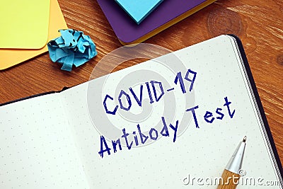 Health concept meaning covid antibody test with phrase on the sheet Stock Photo