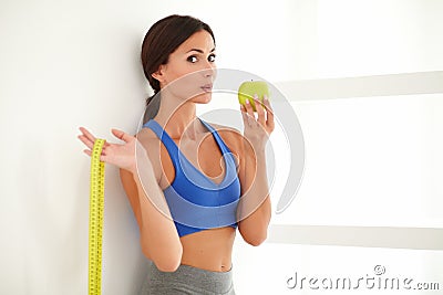 Health-conscious latin lady dieting on apple Stock Photo