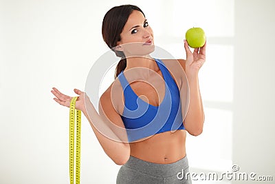 Health-conscious woman losing weight with fruit Stock Photo