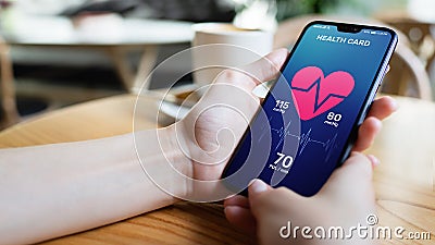 Health control application on smartphone with pulse and arterial pressure control. Concept of modern medical technology. Stock Photo