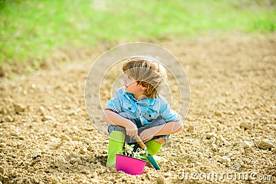 Health and ecology. small kid planting a flower. happy child gardener. botanic worker. Spring season. ecology life. eco Stock Photo